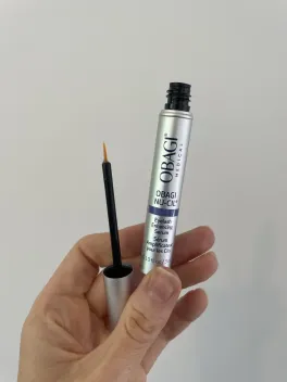 Obagi Nu-Cil open applicator and brush photographed by The Lash List