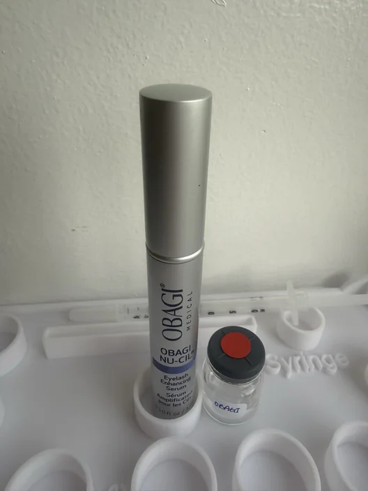 Obagi Nu-Cil tube beside its labeled test sample in The Lash List comparison workspace