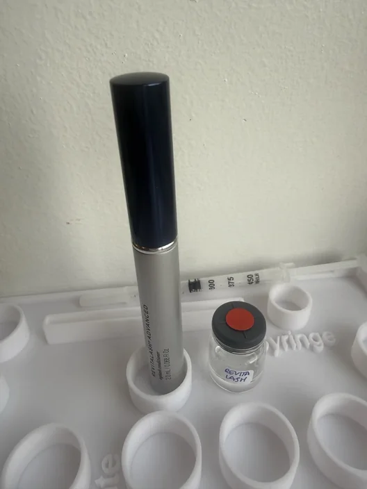 RevitaLash Advanced tube beside its labeled test sample in The Lash List comparison workspace