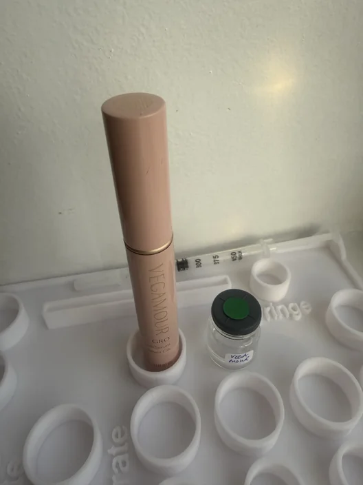 Vegamour GRO tube beside its labeled test sample in The Lash List comparison workspace